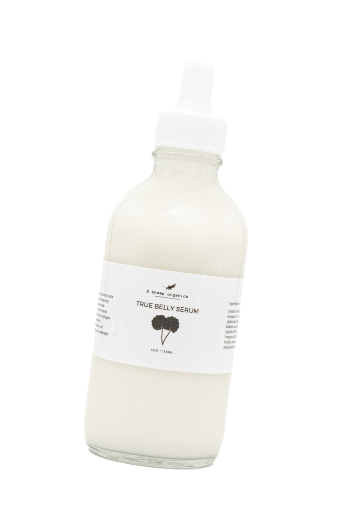 A clear glass bottle with a white dropper cap, filled with a creamy white liquid labeled True Belly Serum by 8 Sheep Organics, against a plain white background.